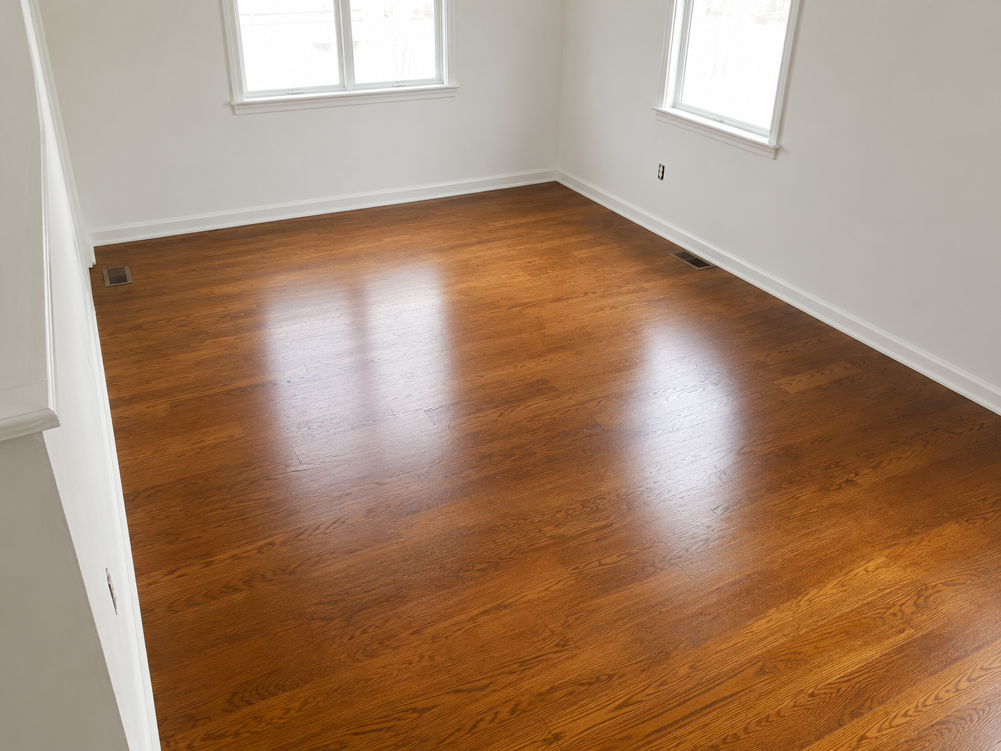 Dark hardwood floor in a freshly finished room