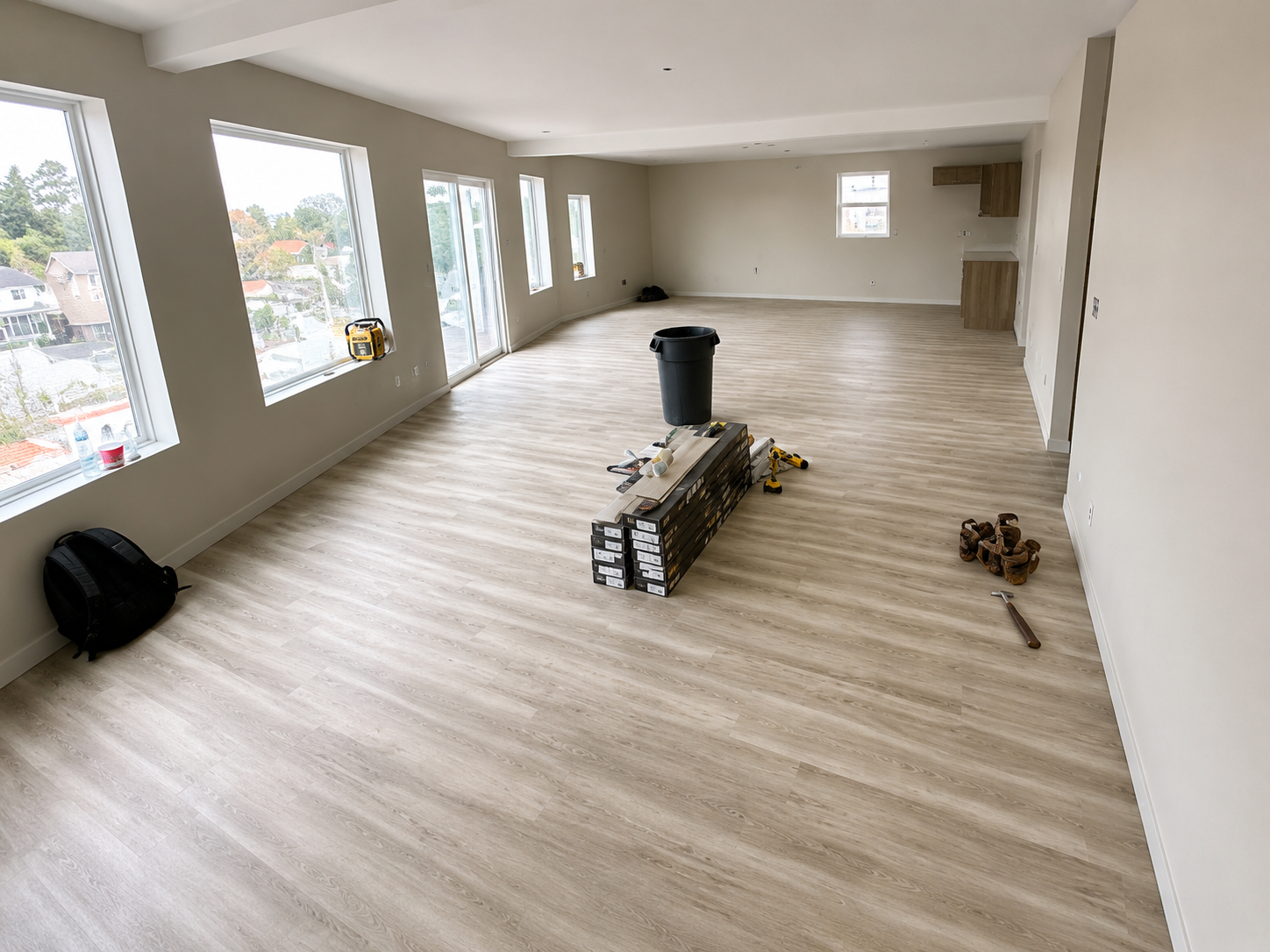 Open loft with light wood flooring and large windows