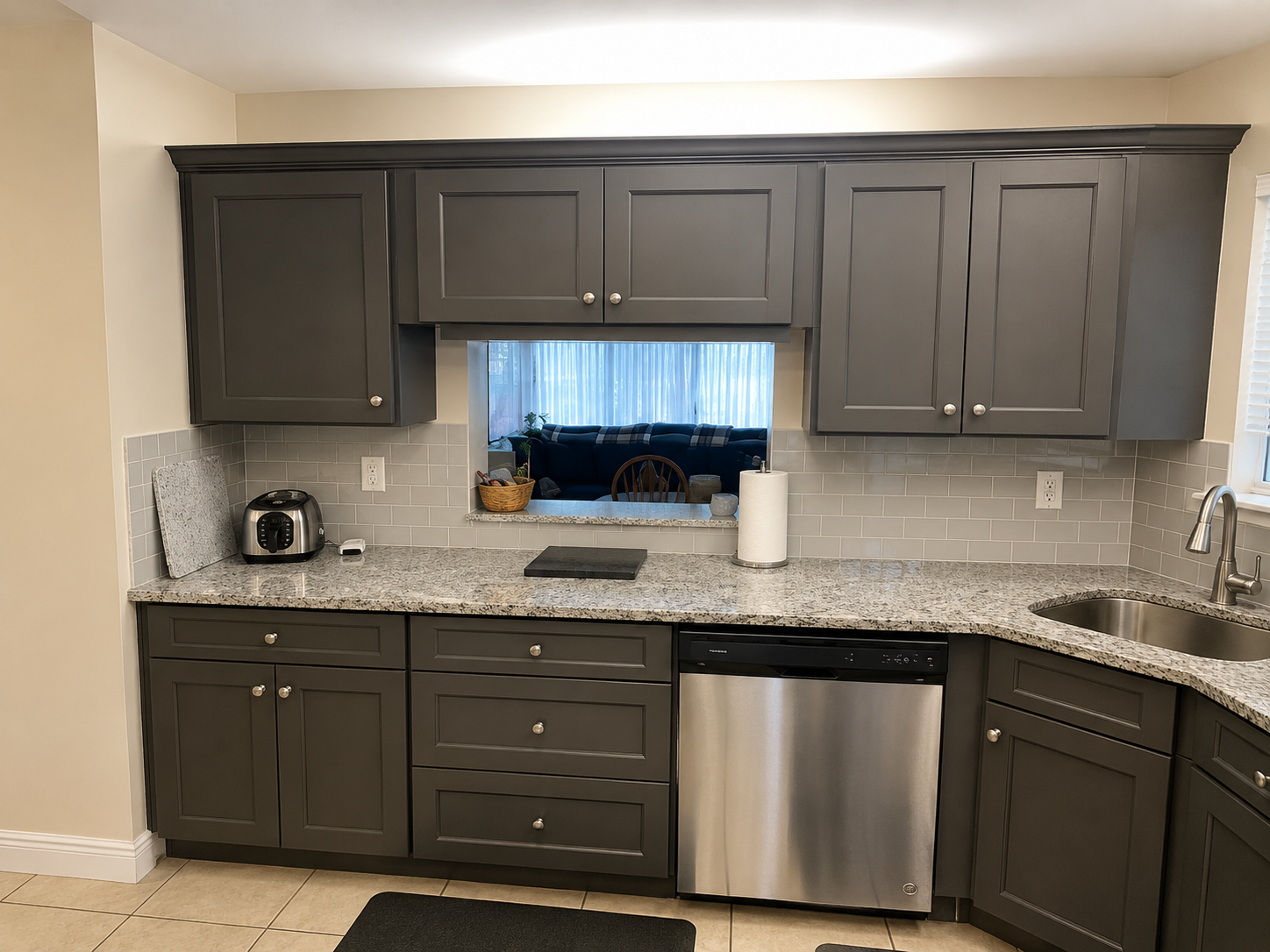 Gray shaker kitchen cabinets with granite countertops