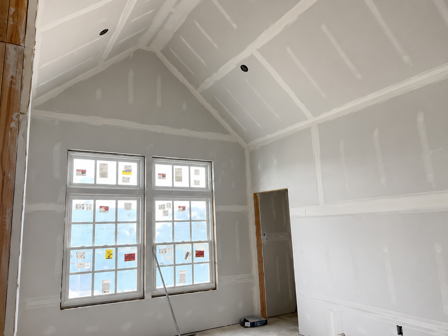 Vaulted ceiling framing and drywall in a new attic bedroom