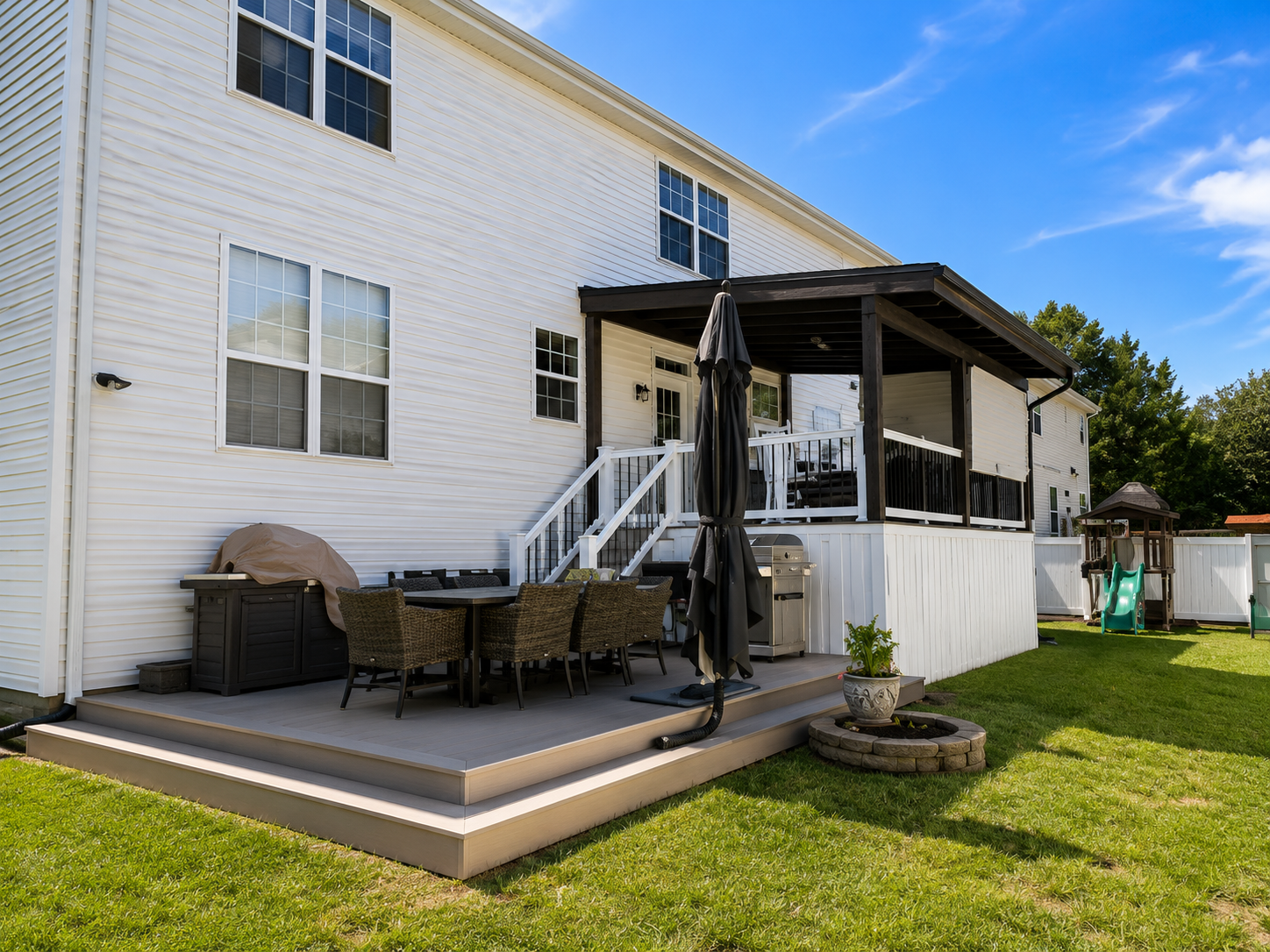 Backyard composite deck with pergola and hot tub